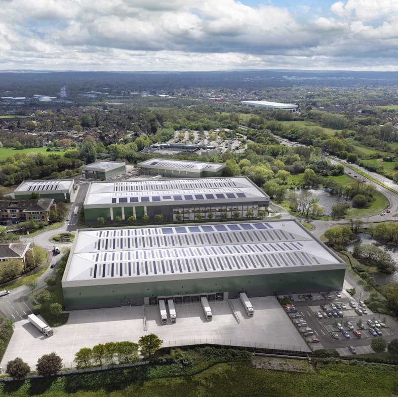 Aerial view of a UK distribution park, with large-format warehouse units set in open countryside